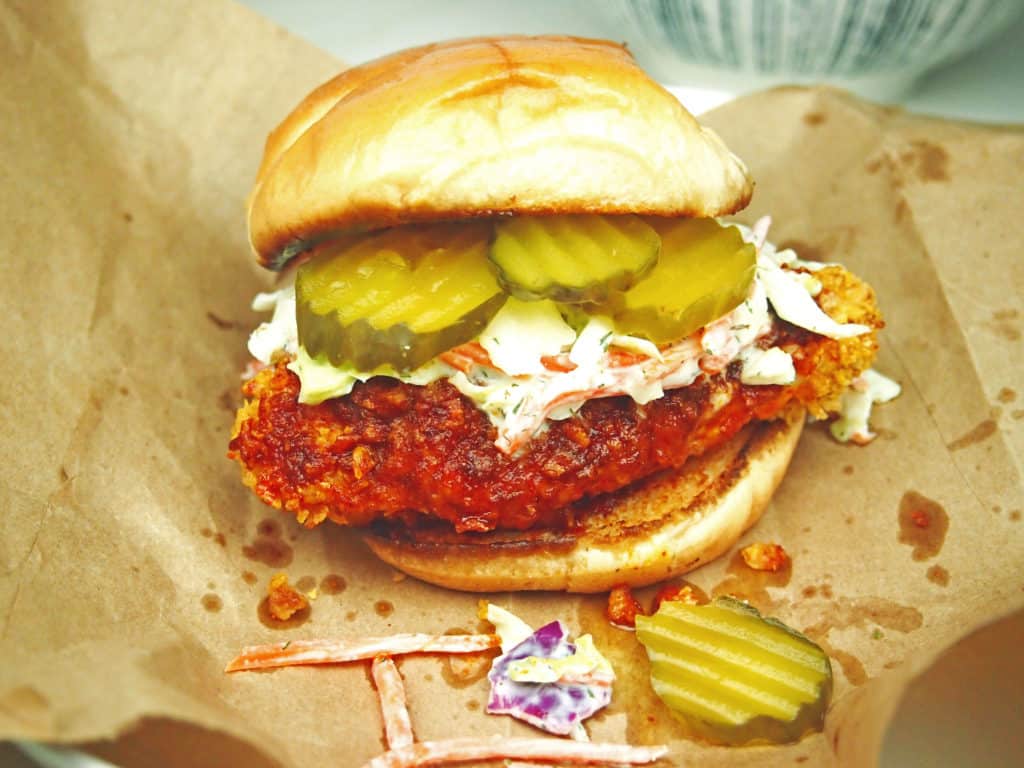 Nashville-style, spicy chicken with cooling slaw and pickles