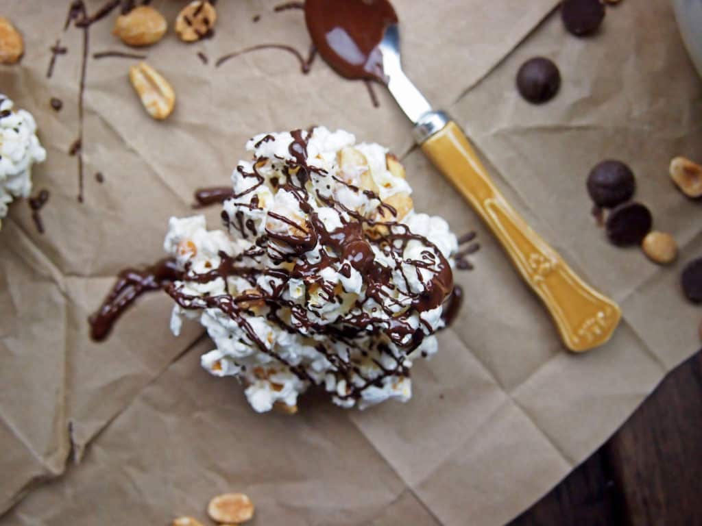 Popcorn cluster with peanuts and chocolate drizzle