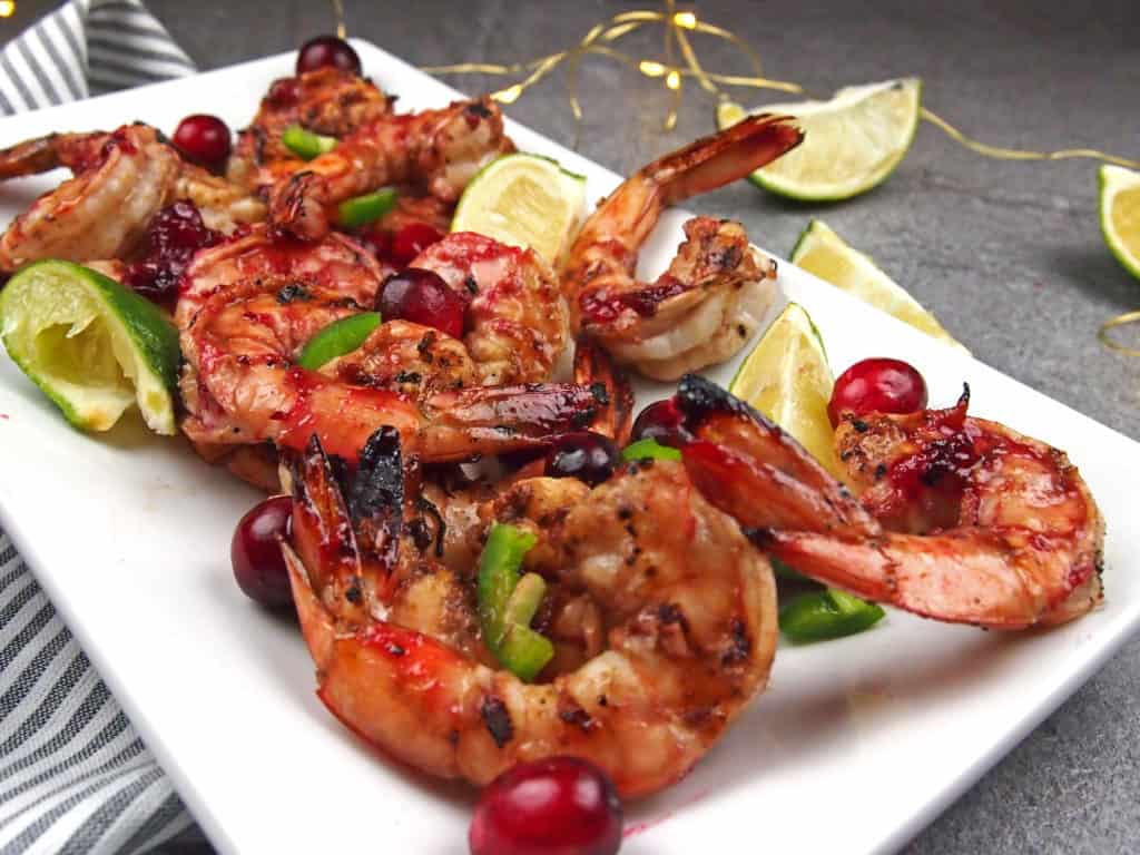 close up of spicy cranberry shrimp with lime