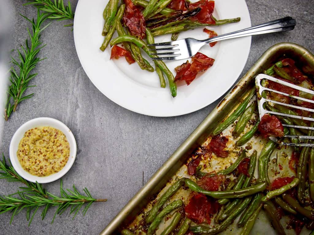 plate of crispy green beans with prosciutto and mustard