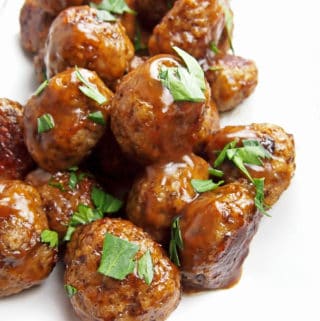 Close up of chicken marsala meatballs garnished with parsley