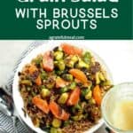 Pinterest image of the salad with the words "Citrus Winter Grain Salad with Brussels Sprouts" in text overlay.