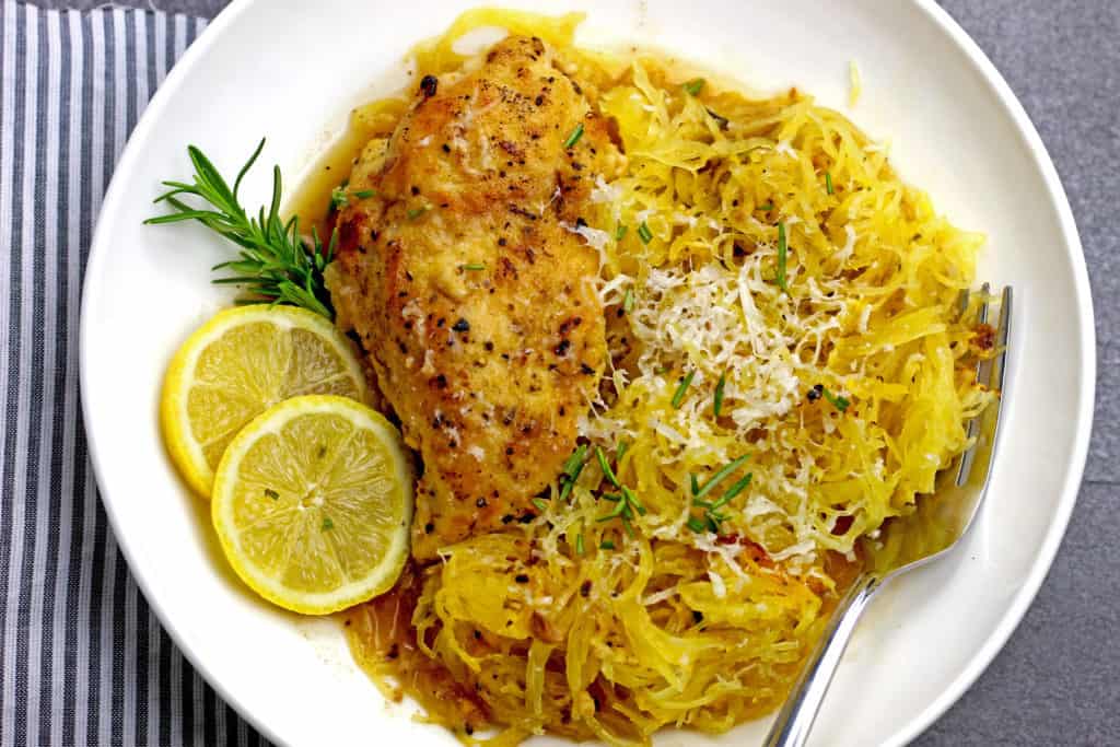 Overview of a plate of braised lemon chicken with spaghetti squash