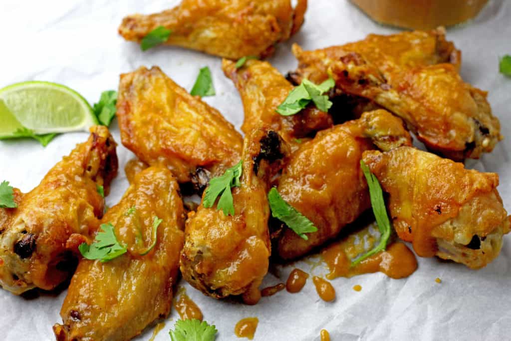 Close up of air fryer wings with mango BBQ sauce.