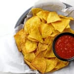 Overview of basket of chips with salsa
