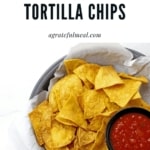 Overview of basket of chips with salsa with the text "air fryer tortilla chips"