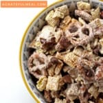 Bowl of churro chex mix on a white background with text overlay that says "Churro Chex Mix"