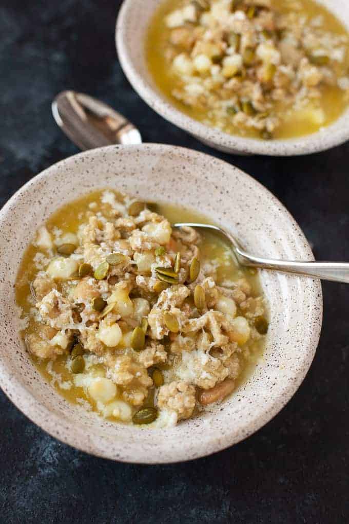 picture of ground turkey slow cooker recipe with a green turkey chili on a dark background