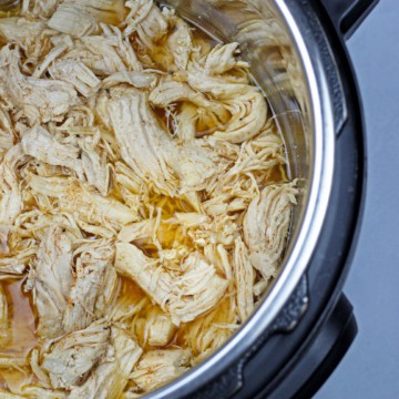 Overview of instant pot shredded chicken in the instant pot bowl.
