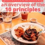 Picture of a plate of blueberries pancakes being eaten at a restaurant with cups of juice on the table with the words "what is intuitive eating, an overview of the 10 principles" and "agratefulmeal.com" in pink lettering