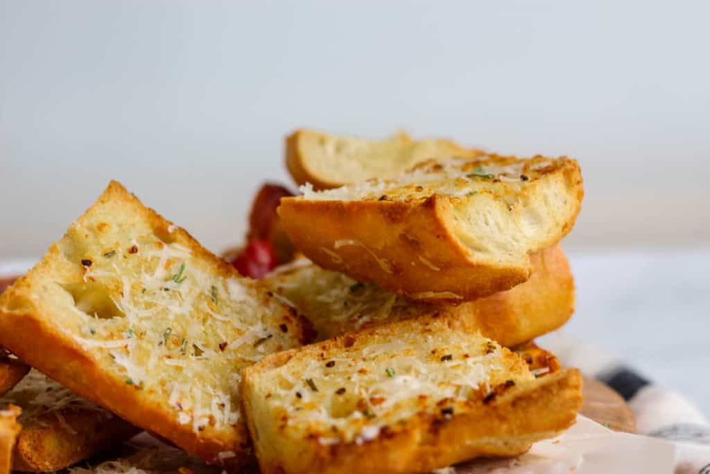 Garlic bread stack on top of each other.