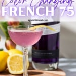 A glass of French 75 on a cutting board with a bottle of gin, lemons, and tulips in the background. The text for Pinterest says in purple: "Empress Gin Color Changing French 75"