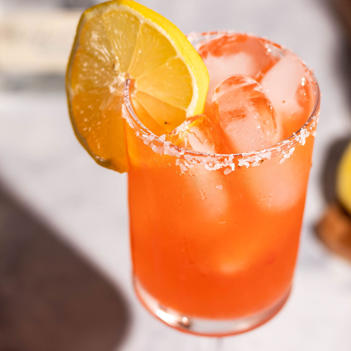 Top view of the strawberry limoncello cocktail with a lemon wheel for a garnish