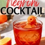 Pinterest image of the cocktail with the words "aperol negroni cocktail" in red and black lettering.