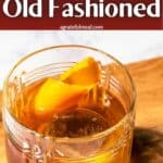 Pinterest image of the cocktail with the words "Dark Rum Old Fashioned" in text overlay.