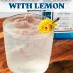 Pinterest image of cocktail with the words Elderflower Gin + Tonic with lemon" in text overlay.