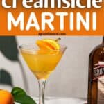 Pinterest image of the cocktail with the words “orange creamsicle martini” in text overlay.
