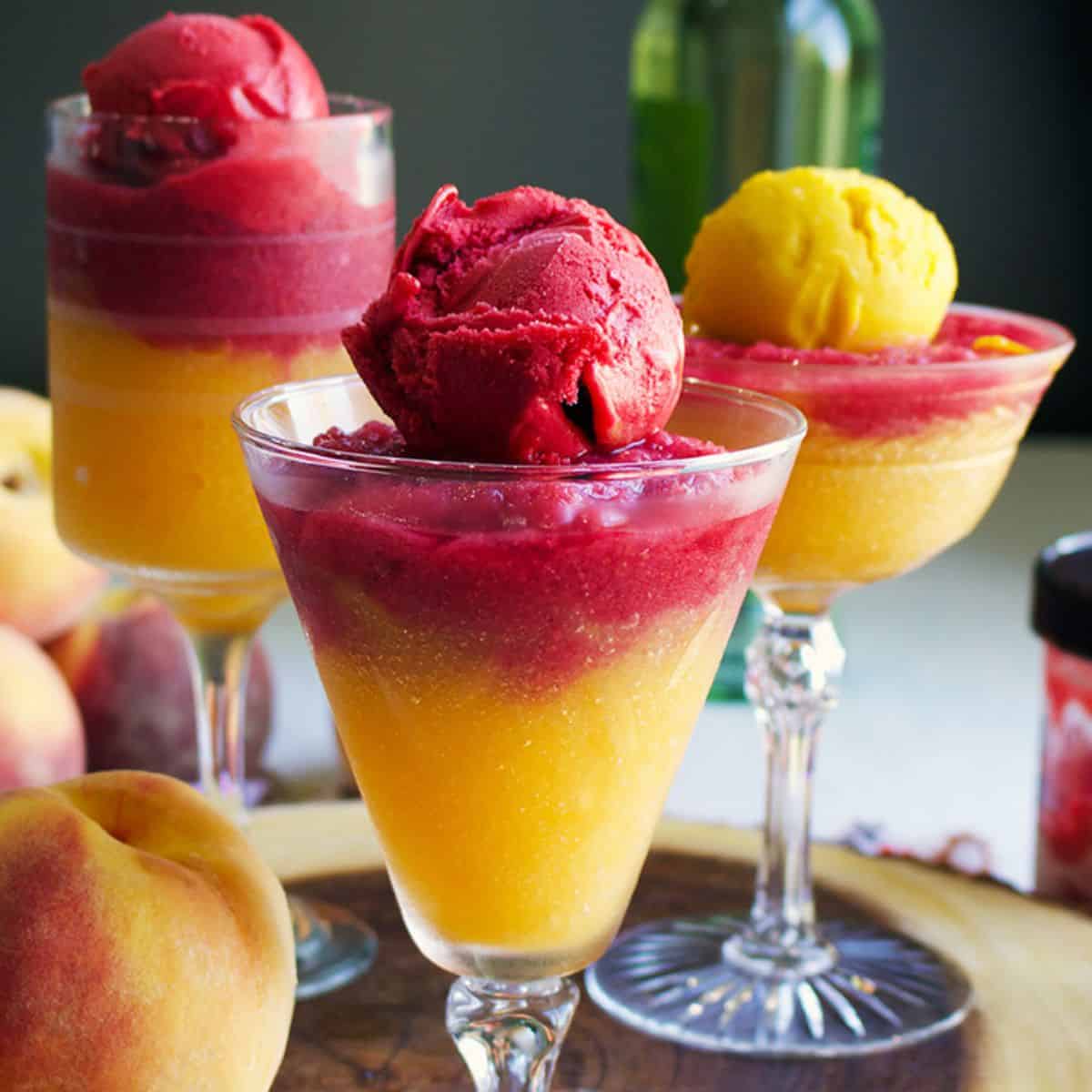 Red and yellow slushies in various glassware.