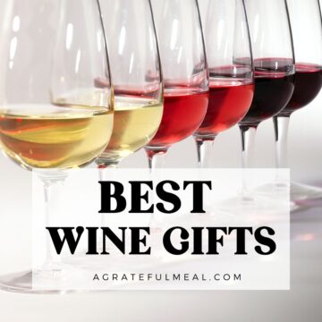 Wine glasses lined up in a row with the words "Best Wine Gifts agratefulmeal.com" in text overlay.