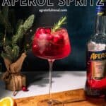 Pinterest image of the cocktail with the words "Cranberry Aperol Spritz" in text overlay.