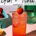 Pinterest image of the cocktail with the words "strawberry gin and tonic" in text overlay.