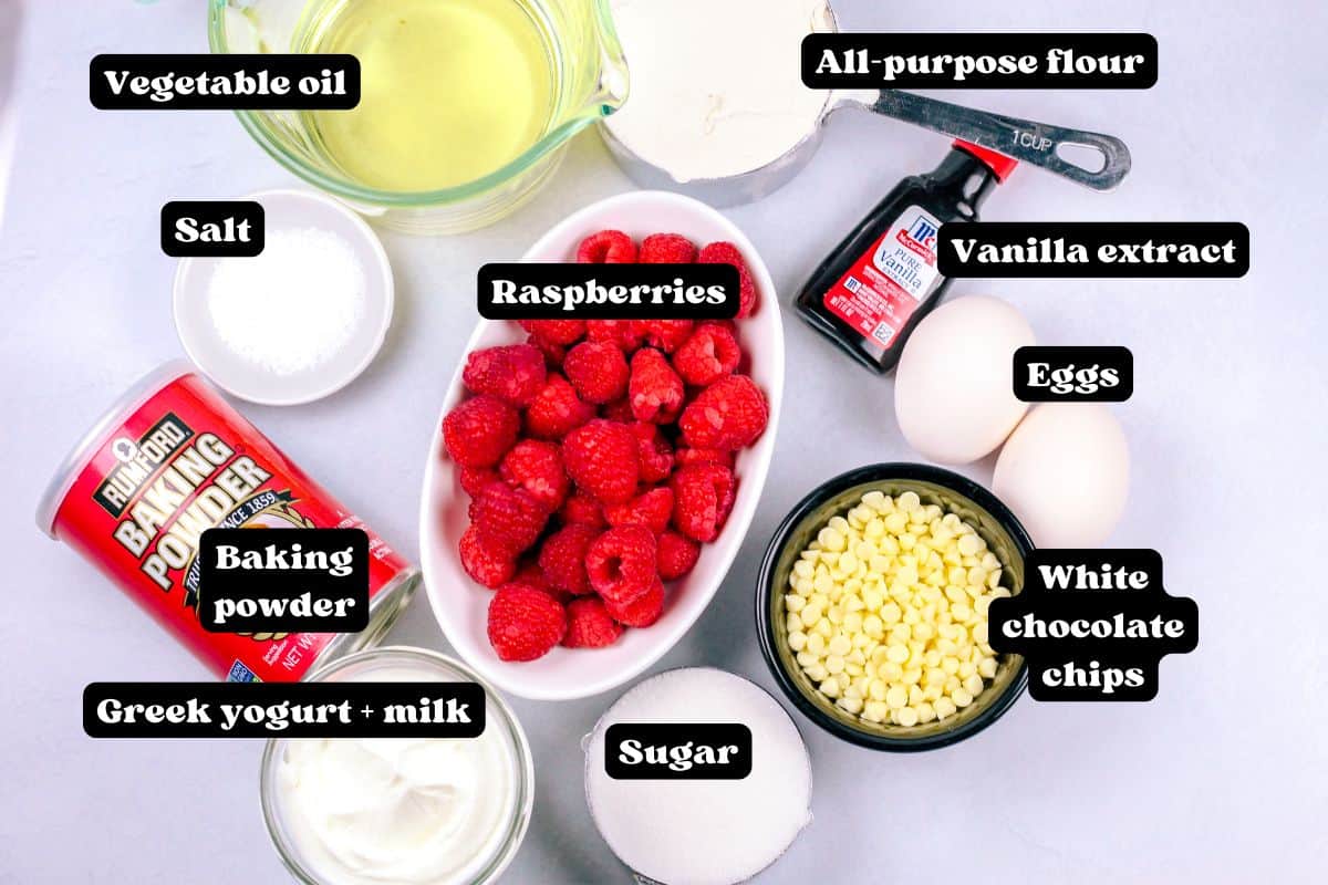 Ingredients for the loaf cake on a white surface.