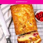 Pinterest image of the cake with the words "White Chocolate Raspberry Loaf Cake" in text overlay.