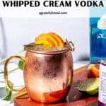 Pinterest image of the cocktail with the words "Moscow Mule with peaches & whipped cream vodka" in text overlay.